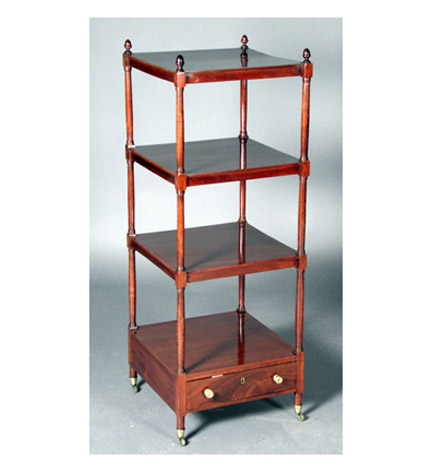 A Regency mahogany etagere with acorn finials and single drawer.