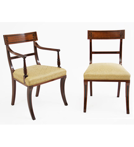 Set of sixteen Regency ebony-inlaid mahogany dining chairs, each broad crestrail with greek-key border, and with sabre legs.