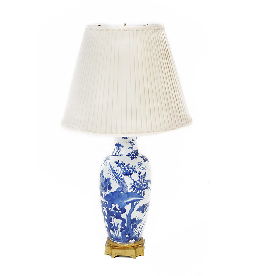 A Chinese blue and white porcelain baluster vase decorated with birds, chrysanthemums and rockwork, on a Louis XVI style gilt bronze base, now mounted as a lamp.