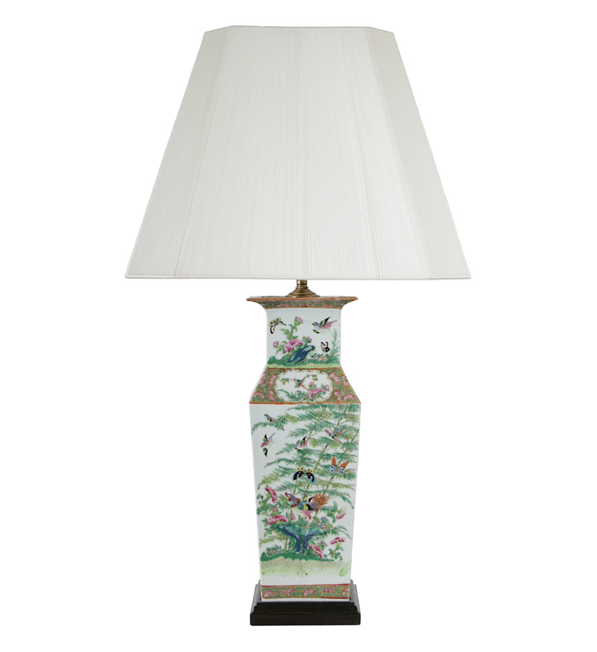 A pair of Canton famille rose enamelled panelled baluster vases decorated with butterflies and bamboo; now mounted as lamps.