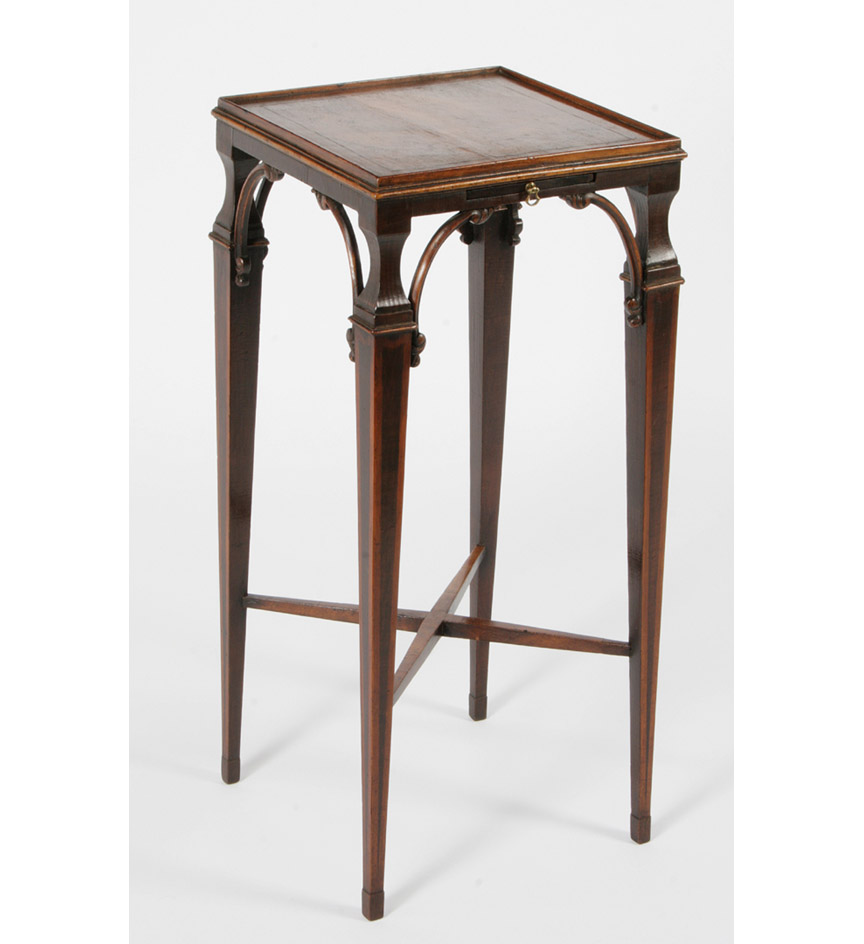 A George III satinwood and harewood urn stand fitted with a candleslide and with C-form corner brackets and tapering square legs joined by an X-form stretcher.