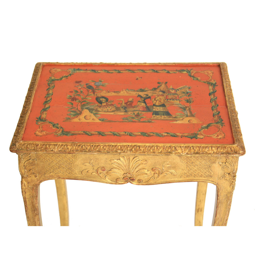 A Continental Rococo gilt-wood side table, the top with lacca povera chinoiserie decoration on a red ground, above a leafage and diaper frieze enclosing a side drawer, raised on cabriole legs.
