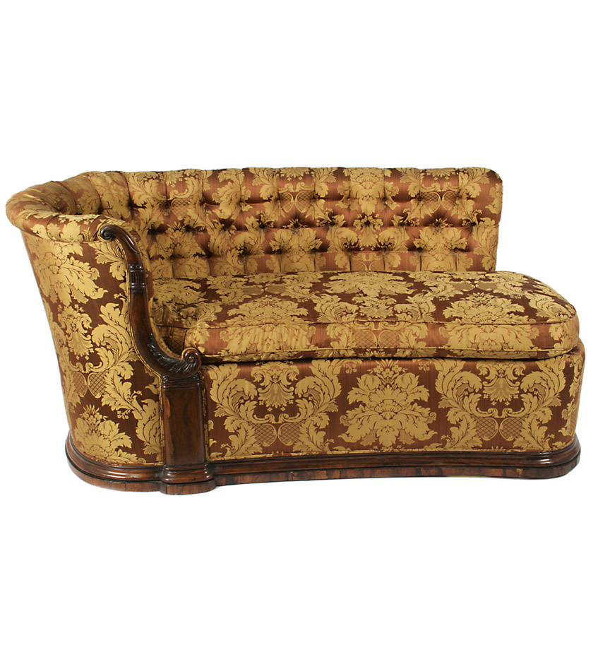 A Continental rosewood upholstered chaise with a high U-form back and a carved S-scroll endrail, on a plinth base.