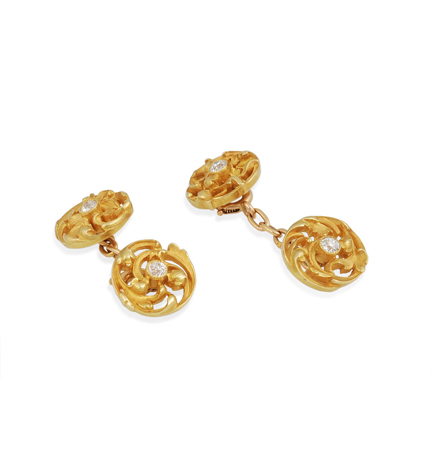 A pair of Art Nouveau gold and diamond cufflinks of scrolled design, in 18k. French.