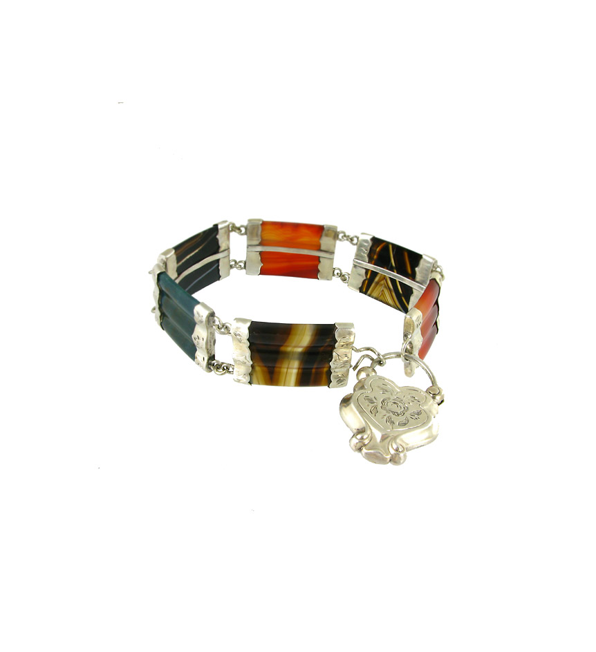 A silver mounted carnelian and agate link bracelet with padlock closure and reeded links.
