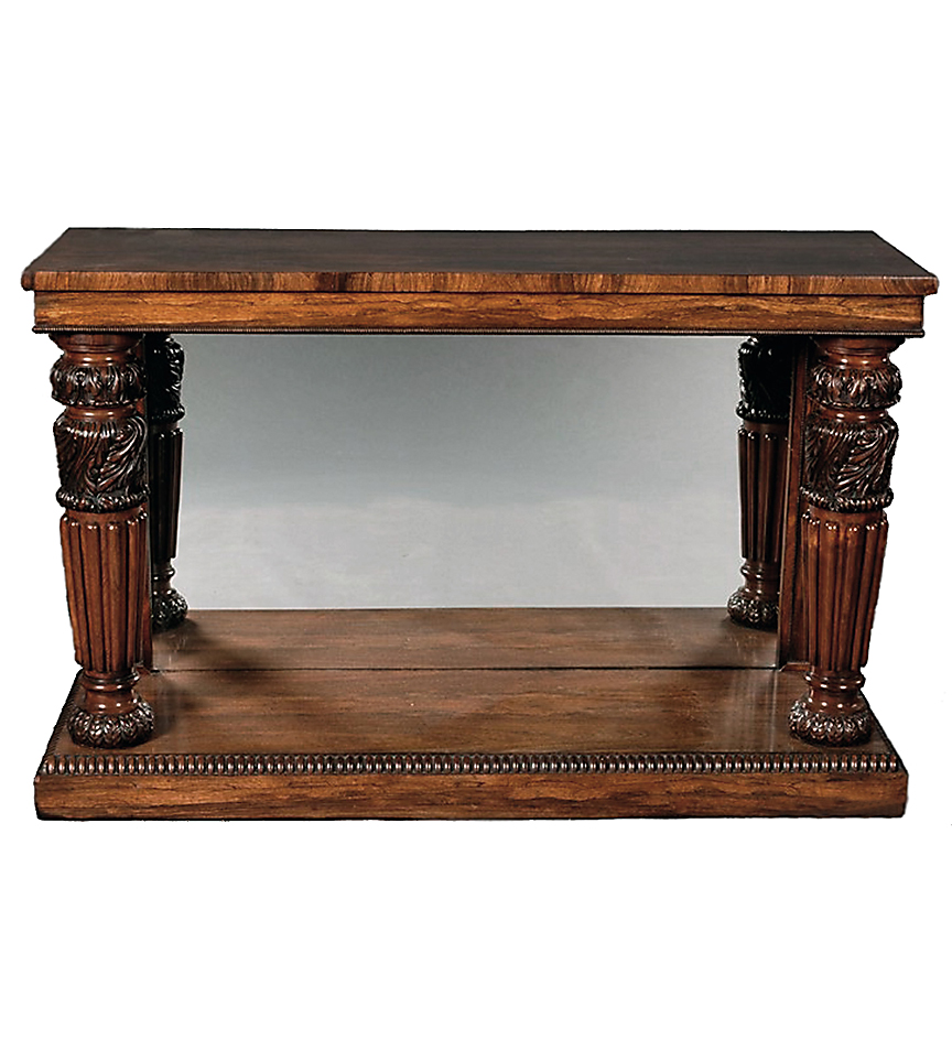 A William IV rosewood pier table with boldly carved and gadrooned legs, mirrored back and plinth base.