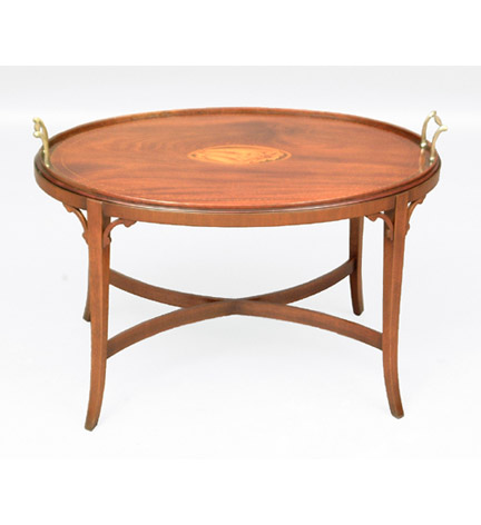 George III Scottish mahogany oval tray with central marquetry shell reserve, and brass handles, now on table base.