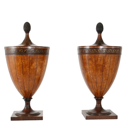 An important pair of George III satinwood and mahogany dining urns with ebony stringing, painted borders and lead lined interiors; the covers topped with pineapple finials.  Possibly by Gillows.  Provenance: By repute, Standish Hall, nr. Wigan, Lancashire and Brandlesome Hall, Lancashire.