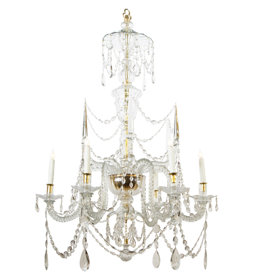 An 18th c. Continental six-light cut-glass chandelier with an urn-form swirl-cut standard and two tiers of swirl-cut arms, the upper with spires and the lower with candles, all hung with swags. 