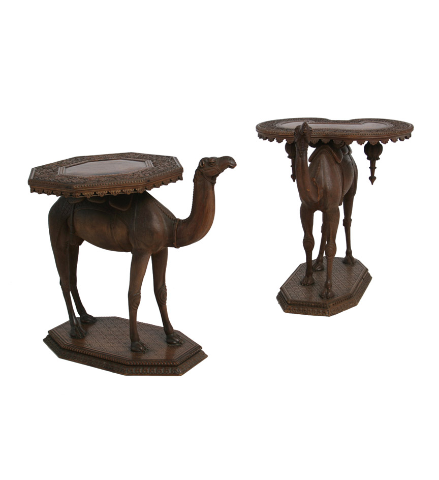 Syrian carved sandalwood table modeled as standing camel with shaped table top. Circa 1880