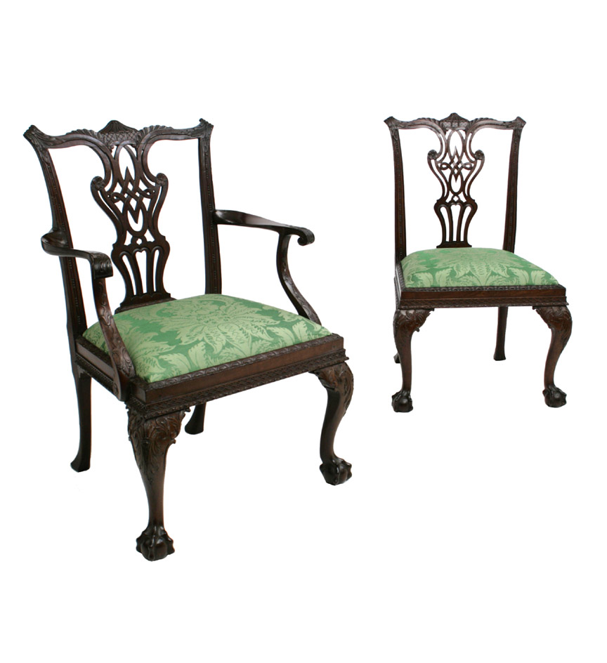 A set of ten George II highly carved mahogany dining chairs in the Chinese Chippendale taste, with pagoda carved crestrails over intricate interlaced back splats, the drop-in seats with carved molded edges and raised on leaf-carved cabriole legs terminating in claw and ball feet. One of later date.