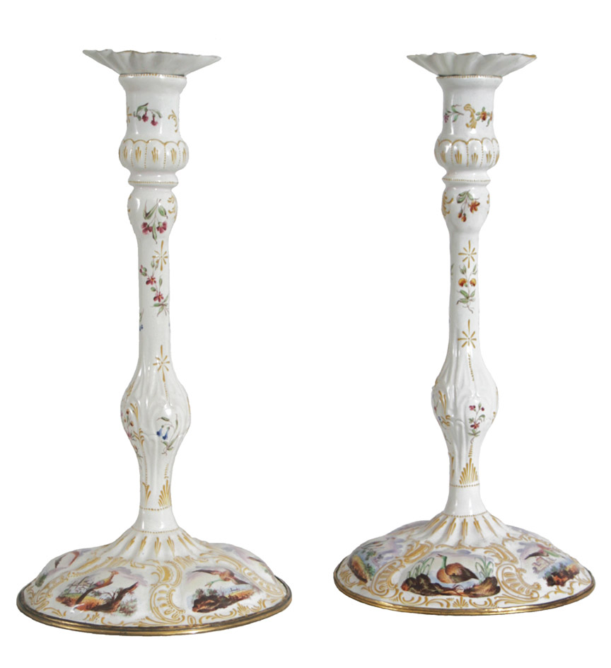 A pair of South Staffordshire enamel candlesticks with avian motifs.  Some restoration.