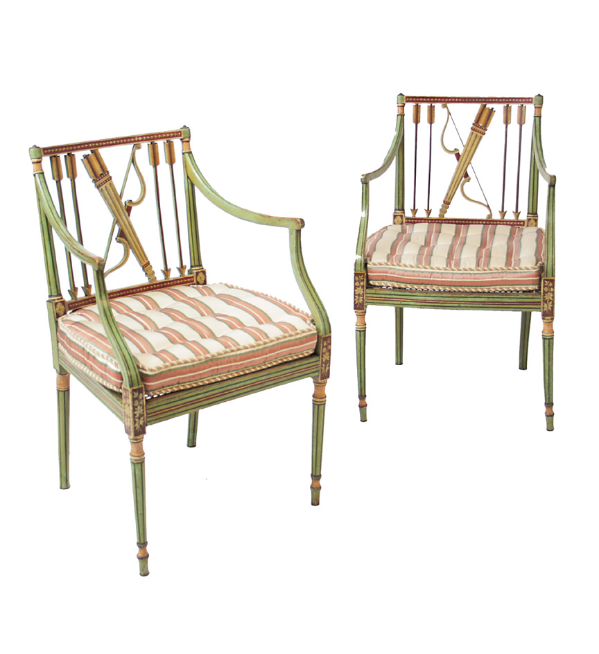 An unusually designed pair of George III green painted square-back open armchairs, the pierced backs decorated with quiver and arrow motif, over caned seats and on tapering square legs.  Now with loose cusion seats.  Paint refreshed.