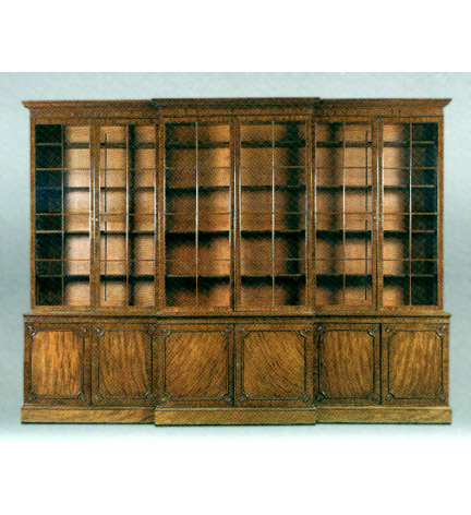 Large George III mahogany breakfront bookcase by John Johnston, with a cavetto cornice over three pairs of glazed panelled doors; the lower section with highly figured panelled doors with moldings and corner roundels, enclosing mahogany-lined drawers,on a plinth base. Metalwork apparently original.