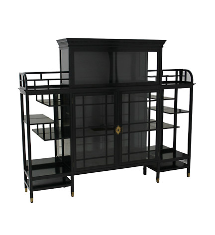 Arts and Crafts ebonized display cabinet in the Japanese taste attributed to E.W. Godwin, the central glazed door cabinet flanked by an arrangement of staggered open shelves, the center surmounted by an additional glass fronted cabinet all on 8 tapered rectangular legs.