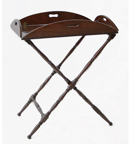 A 19th c. mahogany and brass butler's tray on turned stand with hinged drop sides forming an oval.