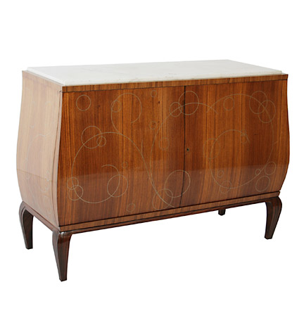 An Italian Art Deco palissander bombe commode with inset white marble top over a pair of sliding doors with pewter-inlaid scrolling designs opening to reveal six mahogany veneered drawers, on contoured feet.