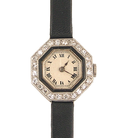 An Art Deco diamond and onyx watch of octagonal design, in platinum. Atw .73cts